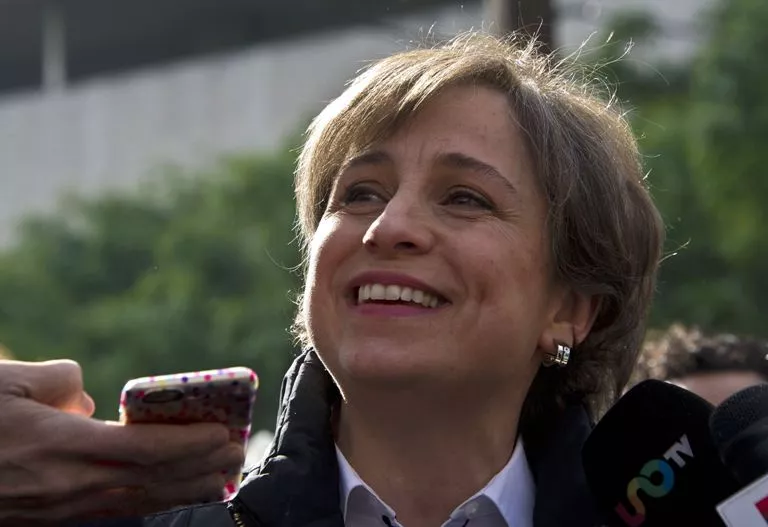 Mexican journalist Carmen Aristegui speaks to the press in Mexico City on March 16, 2015 a day after being fired. Aristegui, an influential Mexican broadcast journalist whose report about the first lady’s mansion caused a scandal was sacked Sunday, sparking anger among supporters who called her firing an affront to freedom of speech. Aristegui had been publicly feuding with her employer, MVS Radio, in recent days after two of her investigative reporters were fired by the company.  AFP PHOTO / RONALDO SCHEMIDT