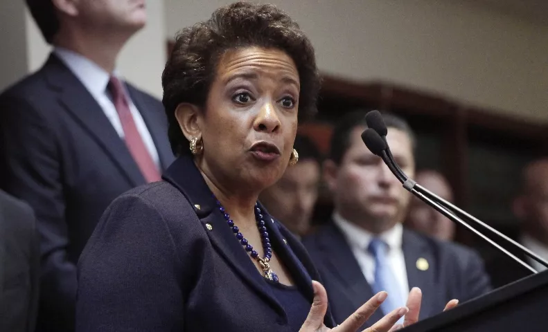 Attorney General Loretta E. Lynch,  Director James B. Comey of the FBI,