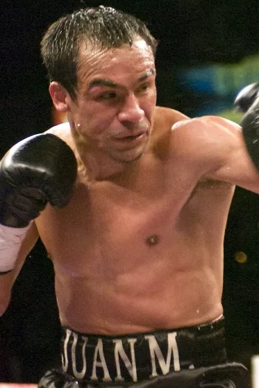 BOXING: PACQUIAO DETHONES MARQUEZ TO CLAIM SUPER FEATHER TITLE