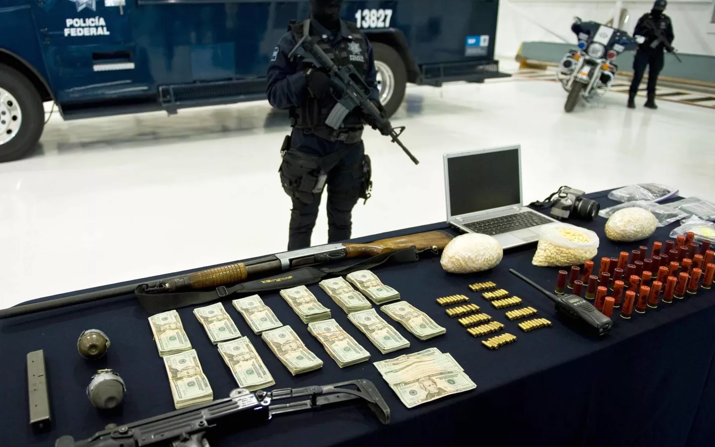 Weapons, ammo, money and drugs seized to