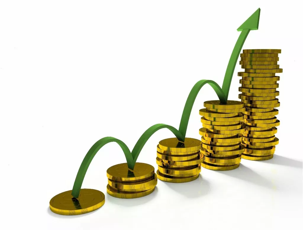 Business Graph with arrow and coins showing profits and gains