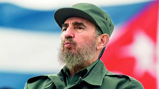 fidel-castro-in-2004-cuba-flag-getty