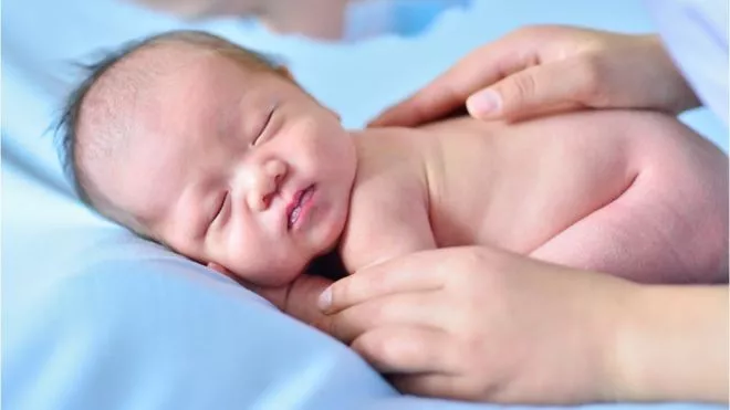 _104844583_babystroking_gettyimages-1072420002