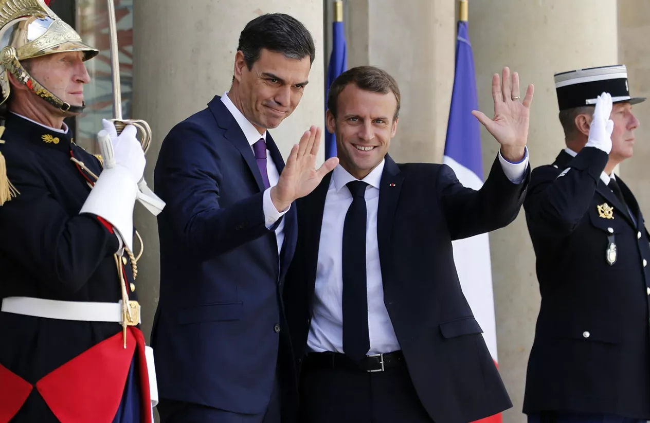 French President Emmanuel Macron greets Spain’s Prime Minister Pedro Sanchez at the Elysee Palace in Paris