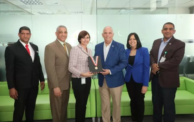 Angel Canó y ejecutivos CNE