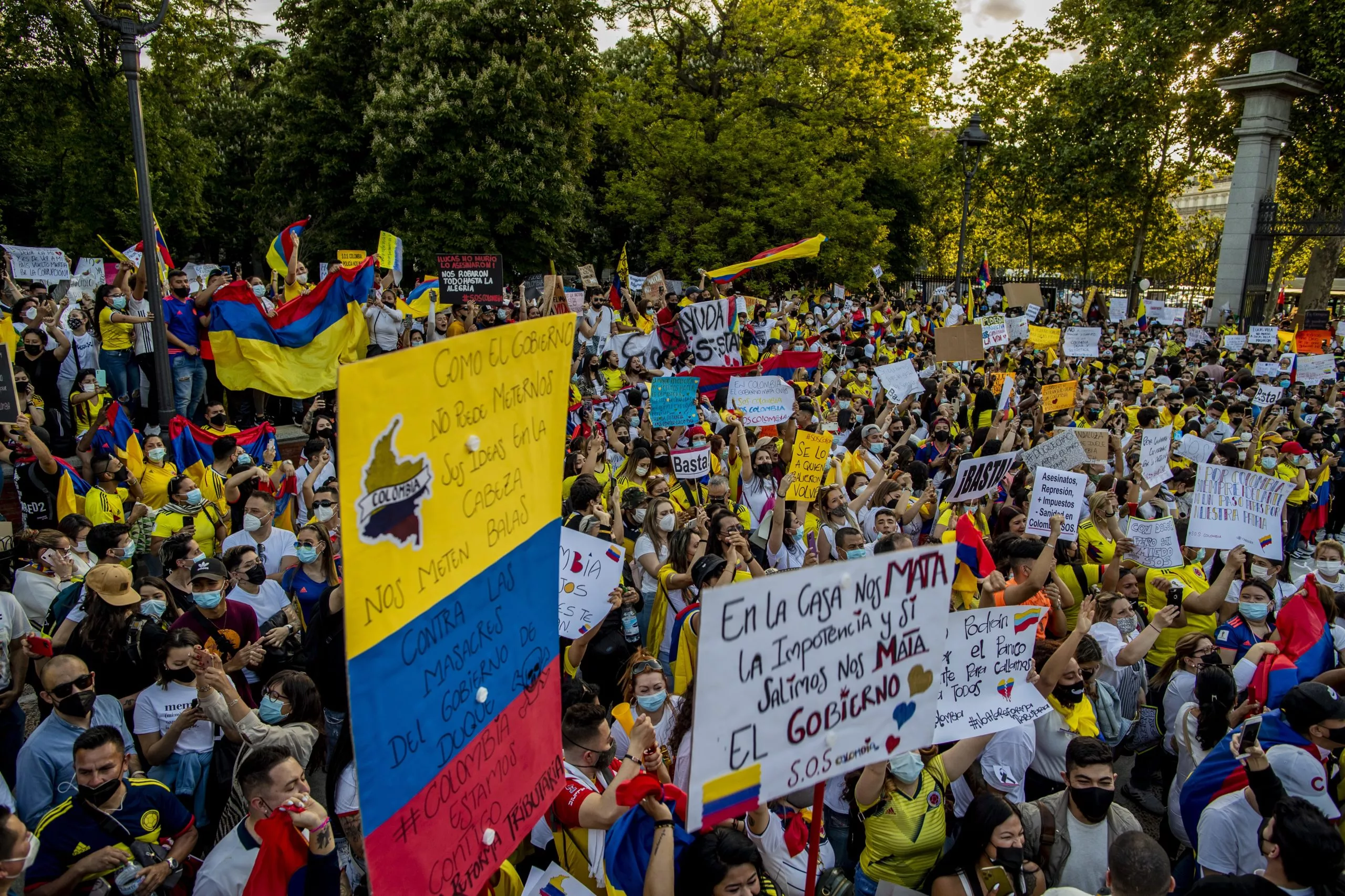 Virus Outbreak Spain Colombia Protest