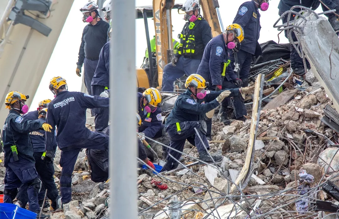 Rescue teams working on the debris of collapsed Champlain Towers South condominium building