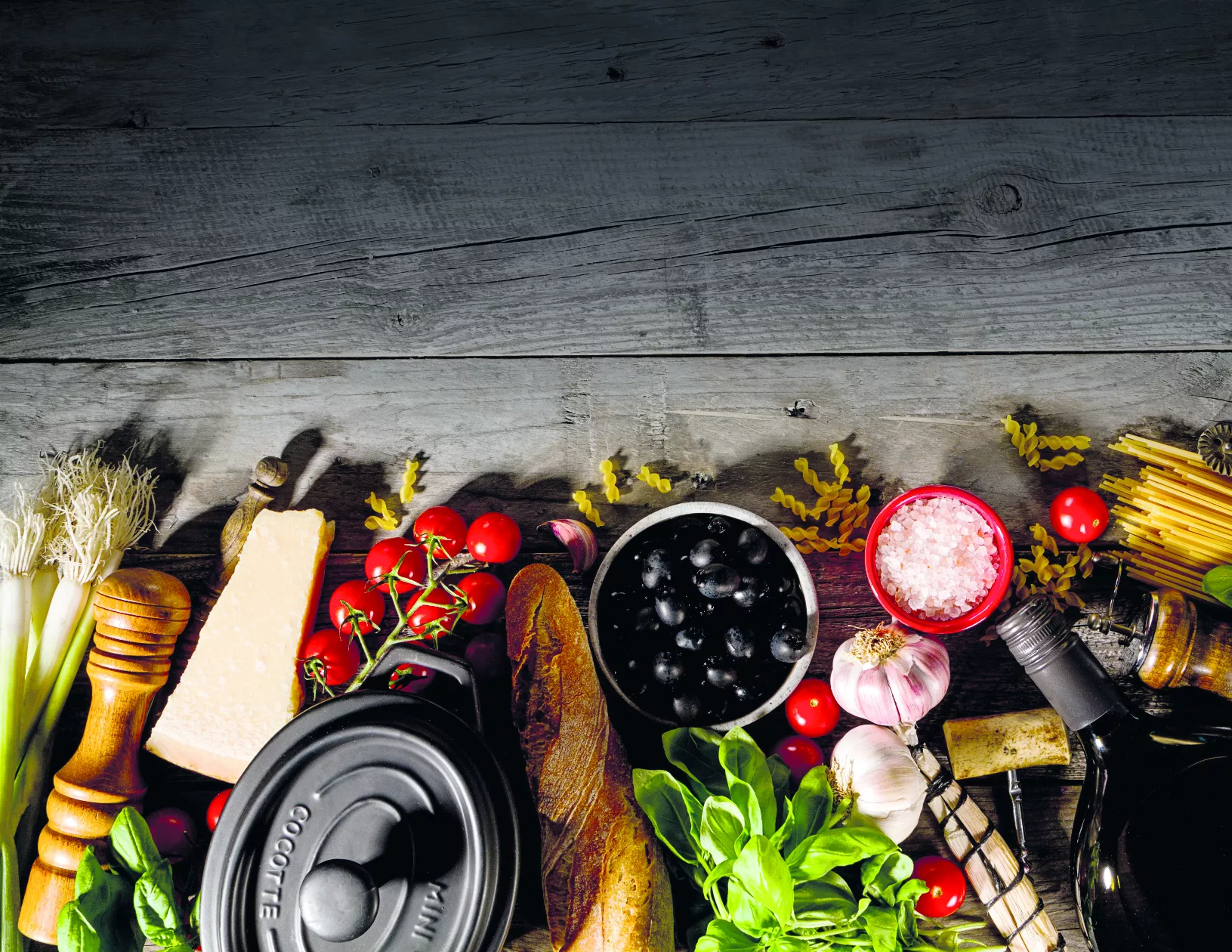 Tasty fresh appetizing italian food ingredients on old rustic wo
