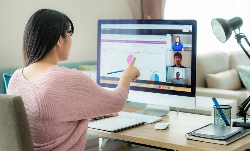 Asian business woman talking to her colleagues about plan in vid