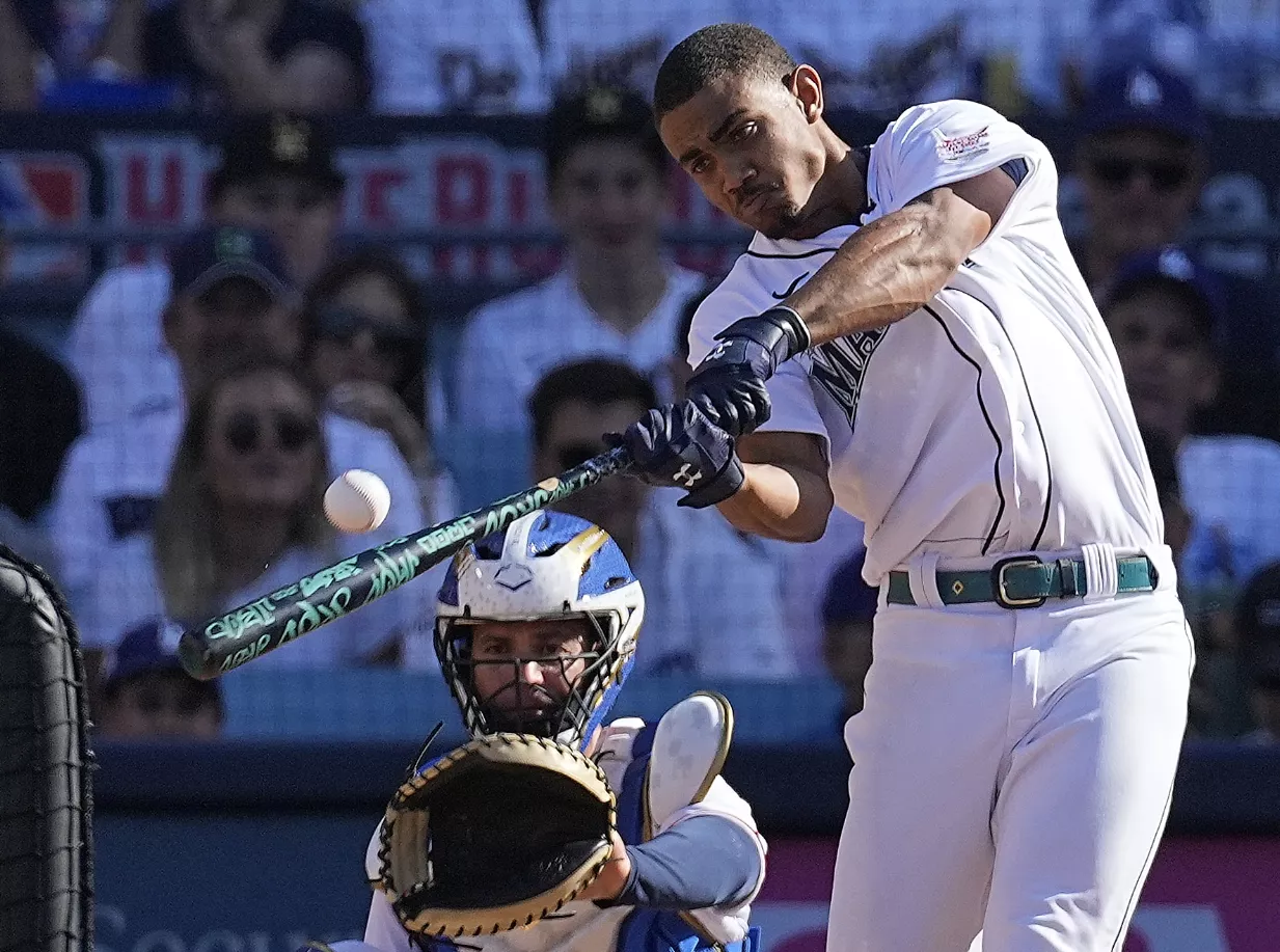 American League's Julio Rodriguez, of the Seattle Mariners, bats during the MLB All-Star baseball Home Run Derby, Monday, July 18, 2022, in Los Angeles. (AP Photo/Jae C. Hong)