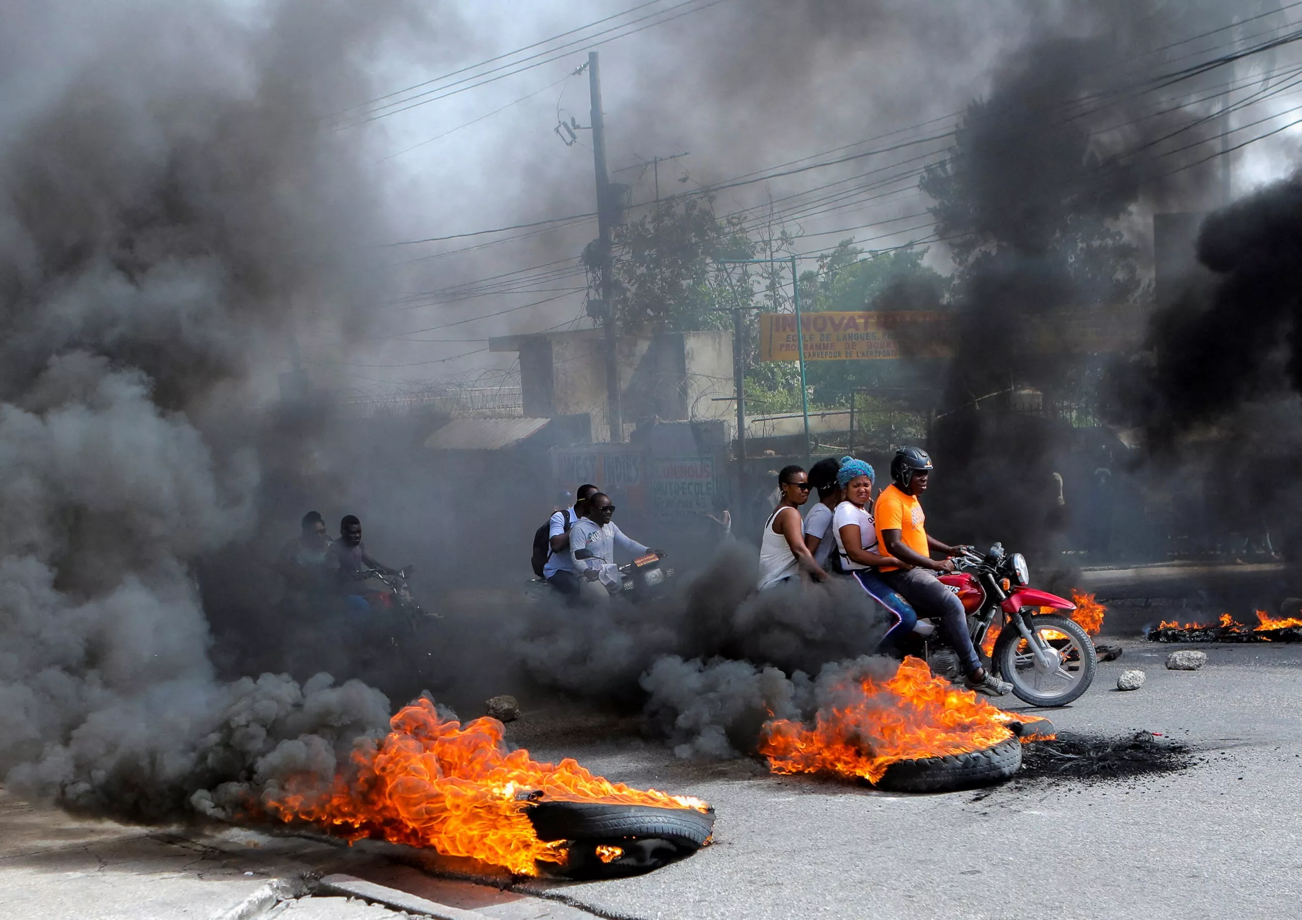 FILE PHOTO: Demonstrators block roads to protest fuel shortages, in Port-au-Prince