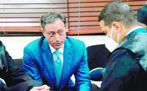 El exprocurador Jean Alain Rodríguez y uno de sus abogados.