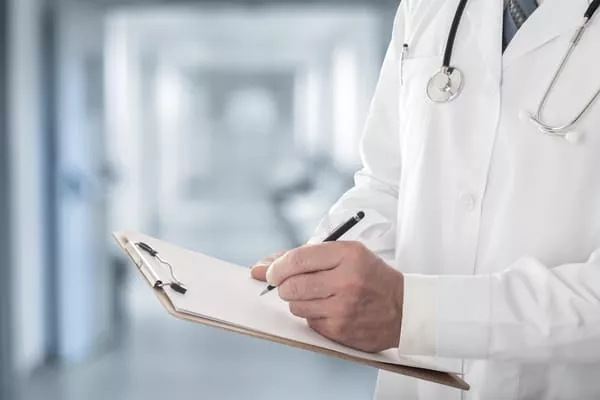 doctor-writing-D3K6QME-1-1
