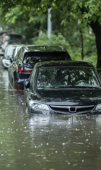 Flooded Cars On The Street Of The City. Street After Heavy Rain.