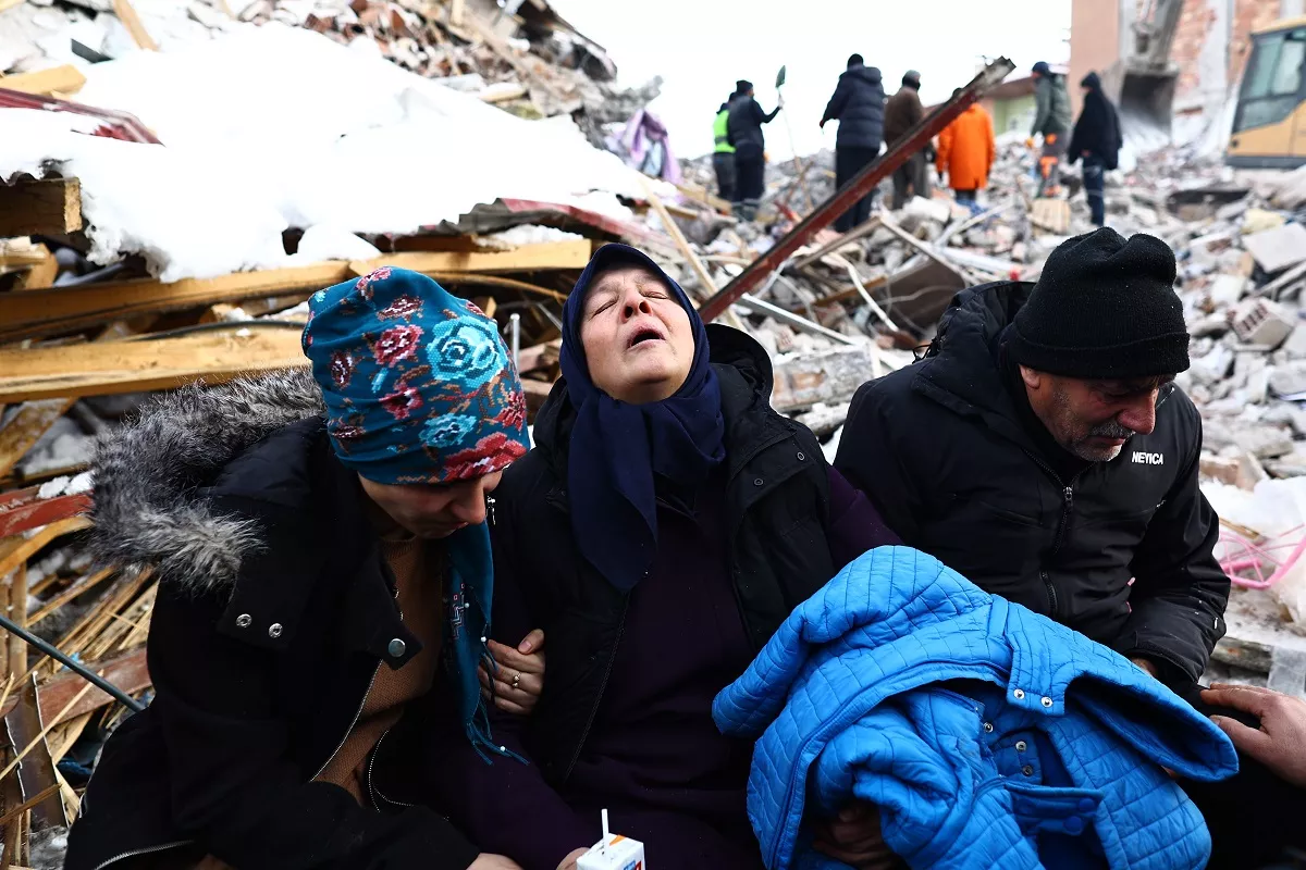 People affected by a major earthquake react at the site of collapsed buildings in Elbistan district of Kahramanmaras