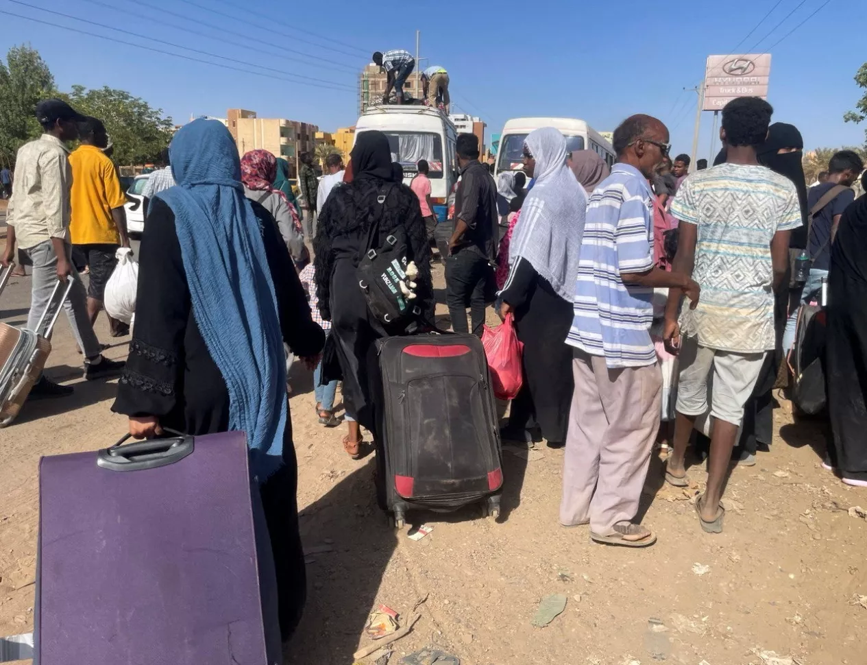 People gather at the station to flee from Khartoum