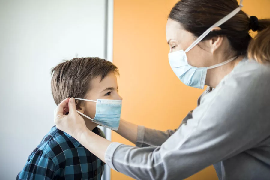 Mother and son with face mask