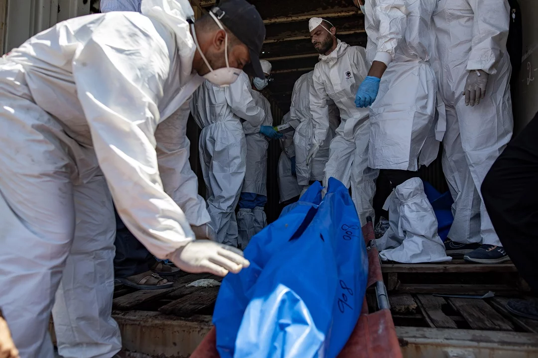 Palestinians bury 84 dead in Khan Younis after bodies returned by Israel